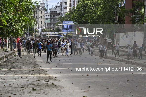 Anti-quota protesters and students backing the ruling Awami League party are clashing on Dhaka University campus in Dhaka, Bangladesh, on Ju...