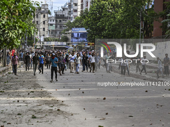 Anti-quota protesters and students backing the ruling Awami League party are clashing on Dhaka University campus in Dhaka, Bangladesh, on Ju...