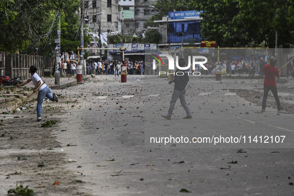 Anti-quota protesters and students backing the ruling Awami League party are clashing on Dhaka University campus in Dhaka, Bangladesh, on Ju...