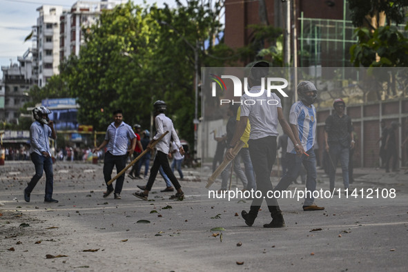 Anti-quota protesters and students backing the ruling Awami League party are clashing on Dhaka University campus in Dhaka, Bangladesh, on Ju...