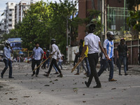 Anti-quota protesters and students backing the ruling Awami League party are clashing on Dhaka University campus in Dhaka, Bangladesh, on Ju...