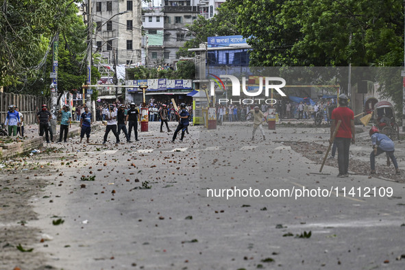 Anti-quota protesters and students backing the ruling Awami League party are clashing on Dhaka University campus in Dhaka, Bangladesh, on Ju...