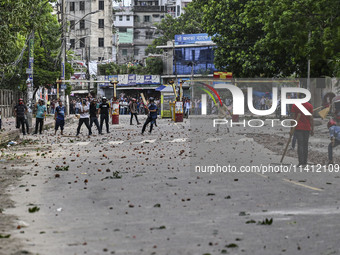 Anti-quota protesters and students backing the ruling Awami League party are clashing on Dhaka University campus in Dhaka, Bangladesh, on Ju...