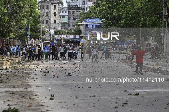 Anti-quota protesters and students backing the ruling Awami League party are clashing on Dhaka University campus in Dhaka, Bangladesh, on Ju...