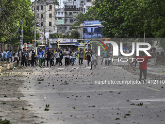 Anti-quota protesters and students backing the ruling Awami League party are clashing on Dhaka University campus in Dhaka, Bangladesh, on Ju...