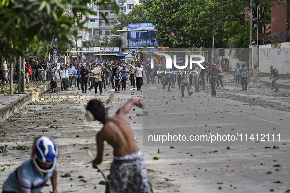 Anti-quota protesters and students backing the ruling Awami League party are clashing on Dhaka University campus in Dhaka, Bangladesh, on Ju...