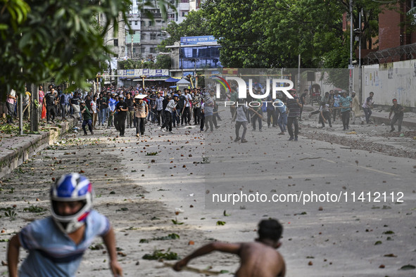 Anti-quota protesters and students backing the ruling Awami League party are clashing on Dhaka University campus in Dhaka, Bangladesh, on Ju...