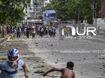 Anti-quota protesters and students backing the ruling Awami League party are clashing on Dhaka University campus in Dhaka, Bangladesh, on Ju...