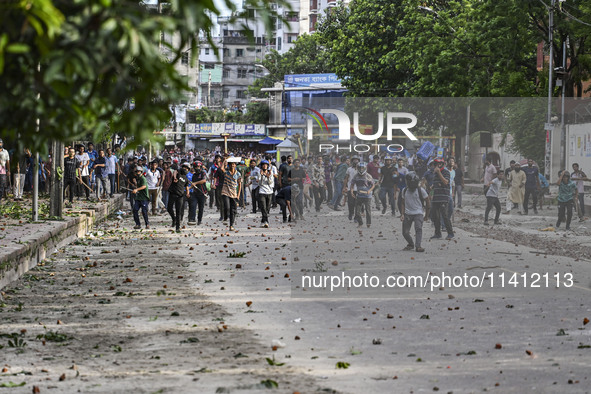 Anti-quota protesters and students backing the ruling Awami League party are clashing on Dhaka University campus in Dhaka, Bangladesh, on Ju...