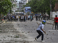 Anti-quota protesters and students backing the ruling Awami League party are clashing on Dhaka University campus in Dhaka, Bangladesh, on Ju...