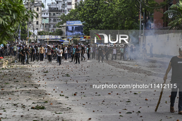 Anti-quota protesters and students backing the ruling Awami League party are clashing on Dhaka University campus in Dhaka, Bangladesh, on Ju...