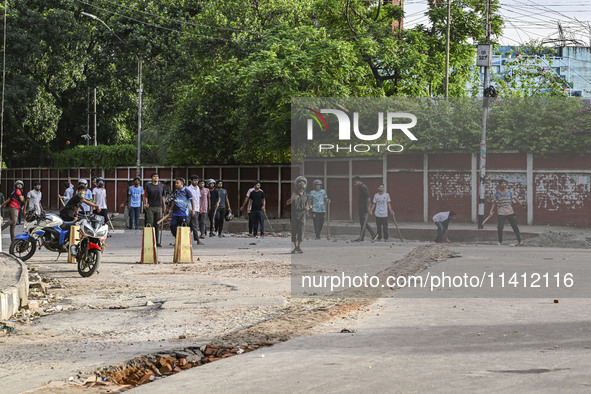 Anti-quota protesters and students backing the ruling Awami League party are clashing on Dhaka University campus in Dhaka, Bangladesh, on Ju...