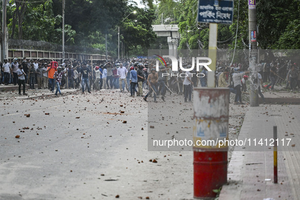 Anti-quota protesters and students backing the ruling Awami League party are clashing on Dhaka University campus in Dhaka, Bangladesh, on Ju...