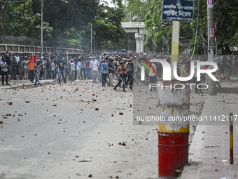 Anti-quota protesters and students backing the ruling Awami League party are clashing on Dhaka University campus in Dhaka, Bangladesh, on Ju...