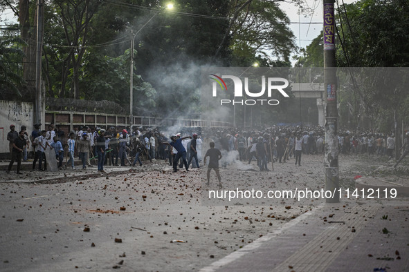 Anti-quota protesters and students backing the ruling Awami League party are clashing on Dhaka University campus in Dhaka, Bangladesh, on Ju...