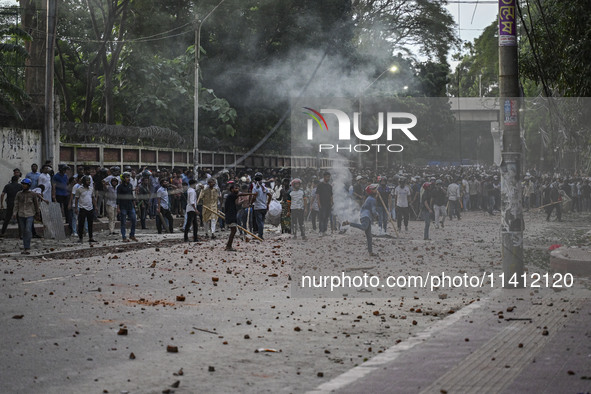 Anti-quota protesters and students backing the ruling Awami League party are clashing on Dhaka University campus in Dhaka, Bangladesh, on Ju...