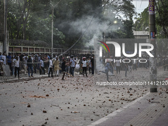 Anti-quota protesters and students backing the ruling Awami League party are clashing on Dhaka University campus in Dhaka, Bangladesh, on Ju...