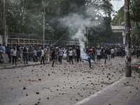 Anti-quota protesters and students backing the ruling Awami League party are clashing on Dhaka University campus in Dhaka, Bangladesh, on Ju...