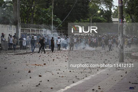 Anti-quota protesters and students backing the ruling Awami League party are clashing on Dhaka University campus in Dhaka, Bangladesh, on Ju...