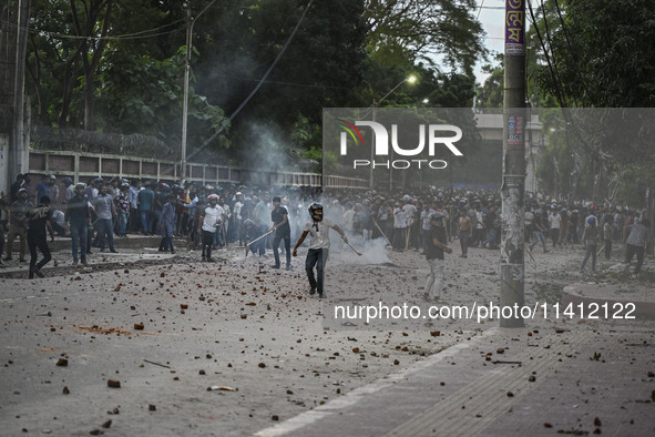 Anti-quota protesters and students backing the ruling Awami League party are clashing on Dhaka University campus in Dhaka, Bangladesh, on Ju...