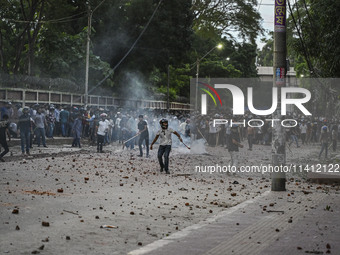 Anti-quota protesters and students backing the ruling Awami League party are clashing on Dhaka University campus in Dhaka, Bangladesh, on Ju...