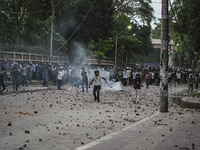 Anti-quota protesters and students backing the ruling Awami League party are clashing on Dhaka University campus in Dhaka, Bangladesh, on Ju...