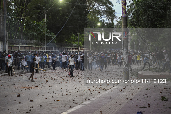 Anti-quota protesters and students backing the ruling Awami League party are clashing on Dhaka University campus in Dhaka, Bangladesh, on Ju...