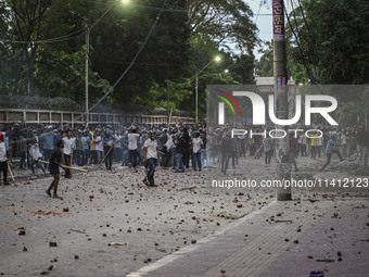 Anti-quota protesters and students backing the ruling Awami League party are clashing on Dhaka University campus in Dhaka, Bangladesh, on Ju...