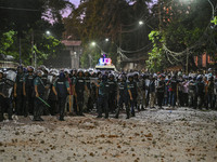 Bangladesh riot police are taking a position in front of Shahidullah Hall during clashes between anti-quota protesters and students backing...