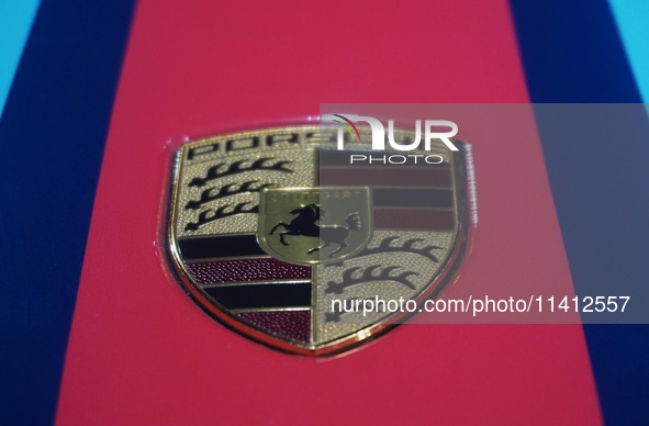 A Porsche logo is being pictured on the body of a supercar ''918 Spyder'' at the West Lake in Hangzhou, China, on July 16, 2024. 