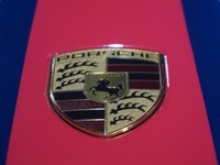 A Porsche logo is being pictured on the body of a supercar ''918 Spyder'' at the West Lake in Hangzhou, China, on July 16, 2024. (