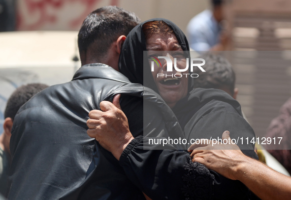 Relatives of the Palestinians, who are dying in Israeli attacks, are mourning at Al-Aqsa Martyr's Hospital in Deir al-Balah, Gaza, on July 1...