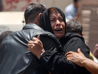 Relatives of the Palestinians, who are dying in Israeli attacks, are mourning at Al-Aqsa Martyr's Hospital in Deir al-Balah, Gaza, on July 1...