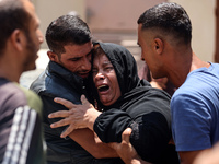 Relatives of the Palestinians, who are dying in Israeli attacks, are mourning at Al-Aqsa Martyr's Hospital in Deir al-Balah, Gaza, on July 1...