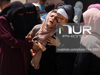 Relatives of the Palestinians, who are dying in Israeli attacks, are mourning at Al-Aqsa Martyr's Hospital in Deir al-Balah, Gaza, on July 1...