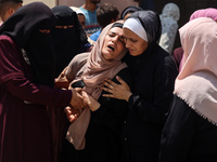 Relatives of the Palestinians, who are dying in Israeli attacks, are mourning at Al-Aqsa Martyr's Hospital in Deir al-Balah, Gaza, on July 1...