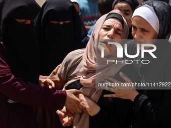 Relatives of the Palestinians, who are dying in Israeli attacks, are mourning at Al-Aqsa Martyr's Hospital in Deir al-Balah, Gaza, on July 1...