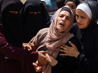 Relatives of the Palestinians, who are dying in Israeli attacks, are mourning at Al-Aqsa Martyr's Hospital in Deir al-Balah, Gaza, on July 1...