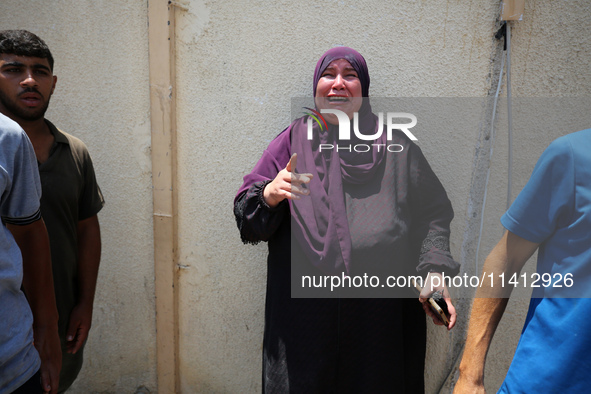 Relatives of the Palestinians, who are dying in Israeli attacks, are mourning at Al-Aqsa Martyr's Hospital in Deir al-Balah, Gaza, on July 1...