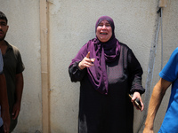 Relatives of the Palestinians, who are dying in Israeli attacks, are mourning at Al-Aqsa Martyr's Hospital in Deir al-Balah, Gaza, on July 1...