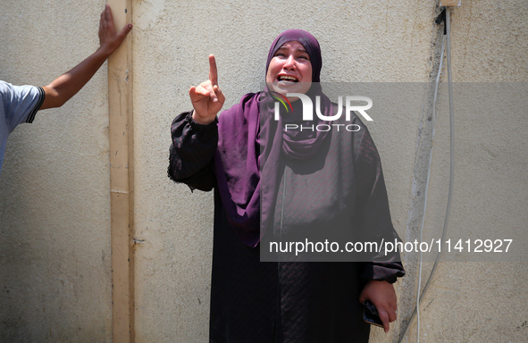 Relatives of the Palestinians, who are dying in Israeli attacks, are mourning at Al-Aqsa Martyr's Hospital in Deir al-Balah, Gaza, on July 1...