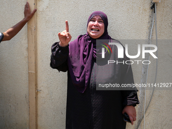 Relatives of the Palestinians, who are dying in Israeli attacks, are mourning at Al-Aqsa Martyr's Hospital in Deir al-Balah, Gaza, on July 1...