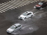 Vehicles are driving through heavy rain in the West Coast New Area of Qingdao, Shandong province, China, on July 16, 2024. (