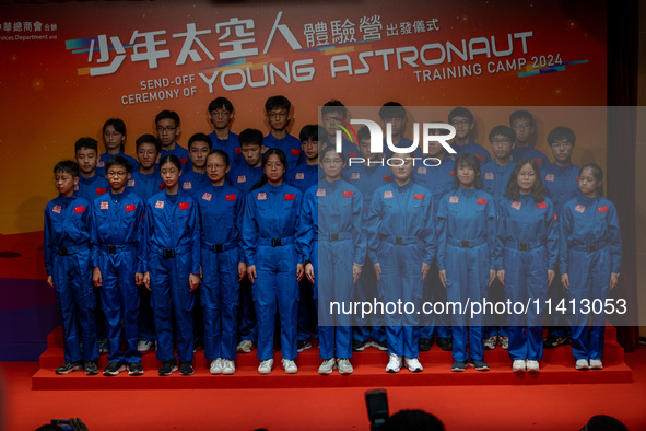 Participants of the Young Astronaut Training Camp 2024 are standing on stage during the send-off ceremony inside the Hong Kong Space Museum...