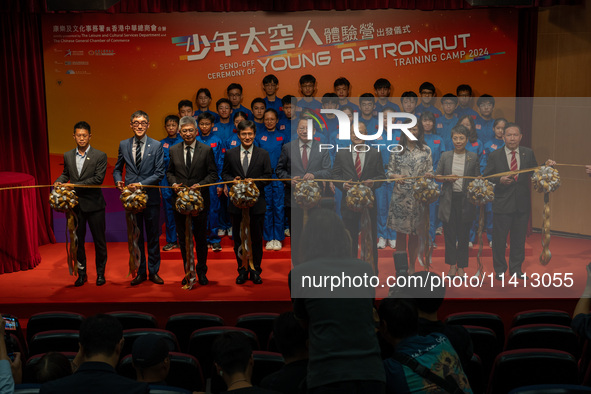 Participants of the Young Astronaut Training Camp 2024 are standing on stage during the send-off ceremony inside the Hong Kong Space Museum...