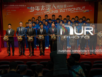 Participants of the Young Astronaut Training Camp 2024 are standing on stage during the send-off ceremony inside the Hong Kong Space Museum...