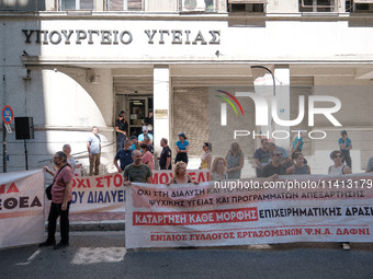 People are protesting outside the Ministry of Health in Athens, Greece, on July 16, 2024, against the new bill concerning the privatization...