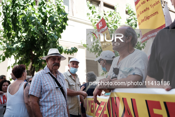 People are protesting outside the Ministry of Health in Athens, Greece, on July 16, 2024, against the new bill concerning the privatization...