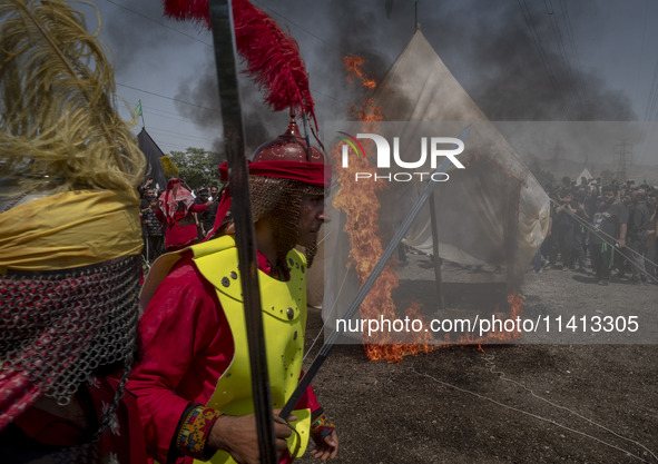 Iraqi men living in Iran are performing in a religious festival to commemorate Ashura in the Dolatabad neighborhood in southern Tehran, Iran...