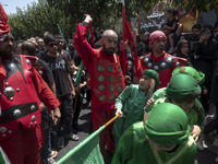 Iraqi men and children living in Iran are performing in a religious festival to commemorate Ashura in the Dolatabad neighborhood in southern...